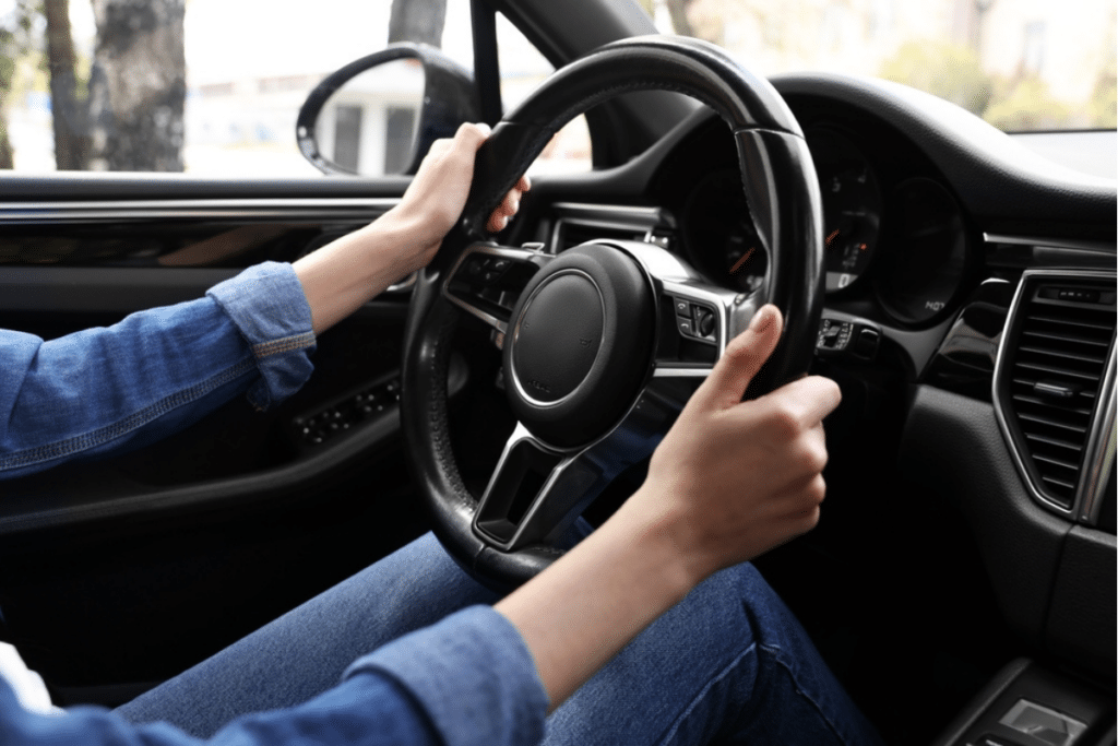 Steering Wheel Vibration When Braking in Greer, SC by Eastside Automotive: A close-up view of a driver’s hands on a shaking steering wheel, emphasizing the need for brake inspection and repair to ensure safe driving.