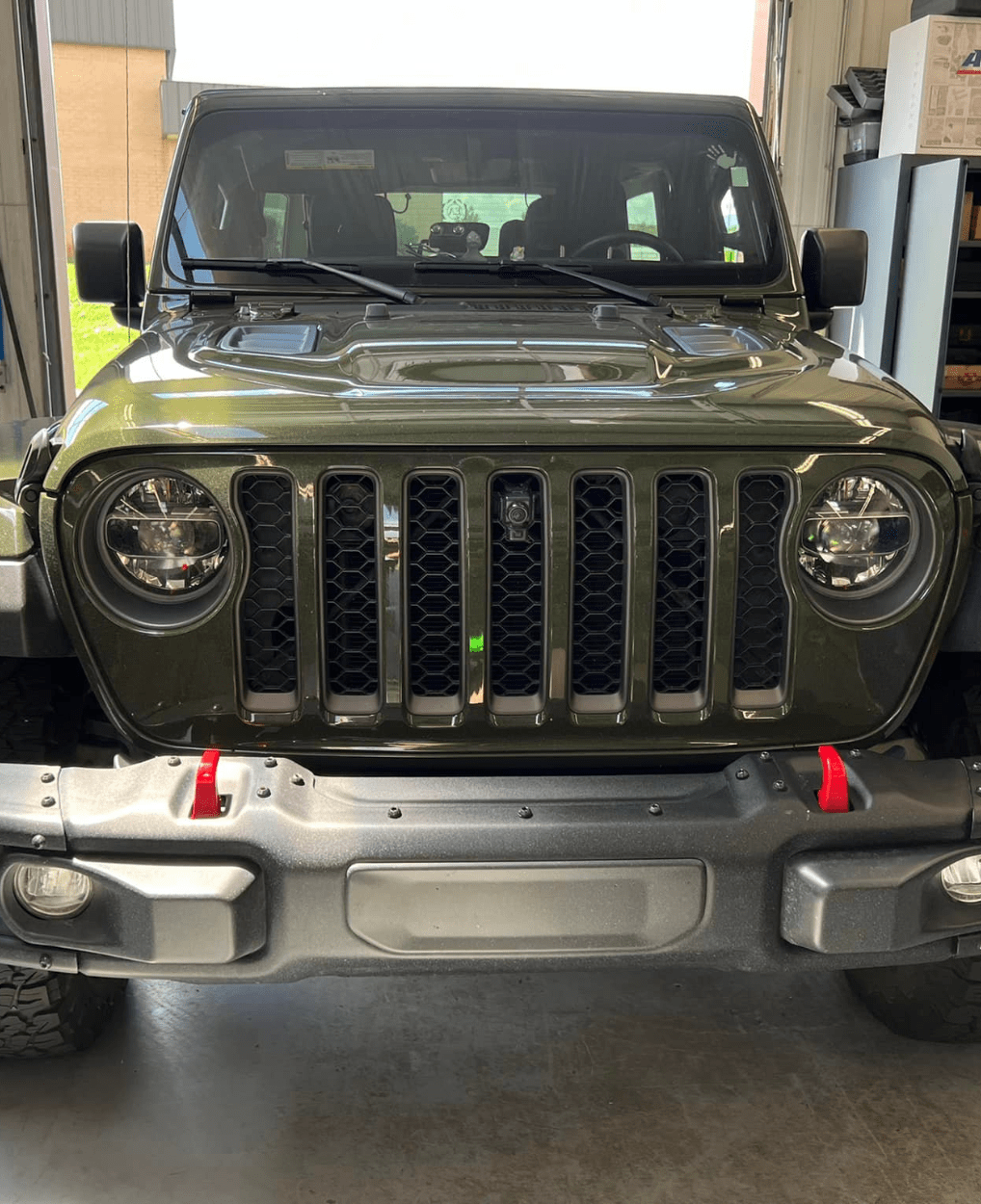 Jeep repair in Greer, SC by Eastside Automotive. Image of a green Jeep Wrangler inside the shop, highlighting professional service and upgrades to keep off-road vehicles performing safely and reliably.