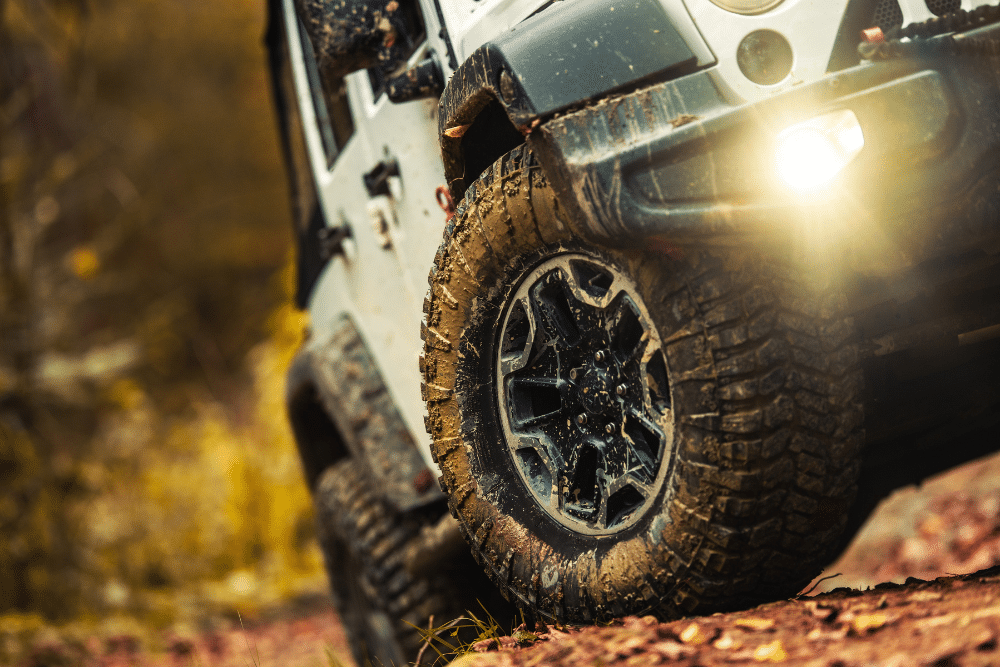 Off-Road Trail Prep in Greer SC At Eastside Automotive. Close-up view of a Jeep driving off-road on a rugged trail